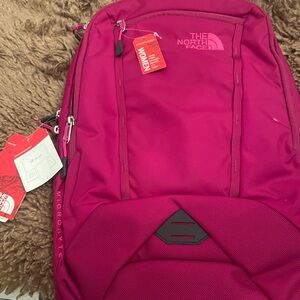 Brand new magenta North Face microbyte backpack.  With tags, no wear.